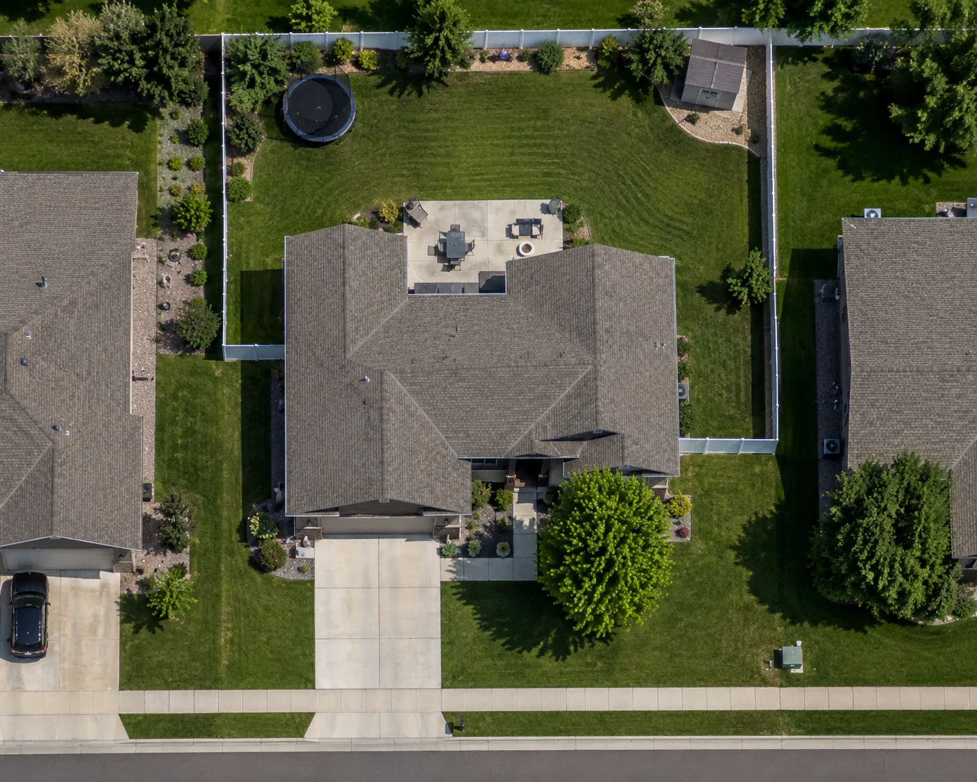Aerial view of a property with the back yard, front yard, and driveway measured as separate square-footage areas