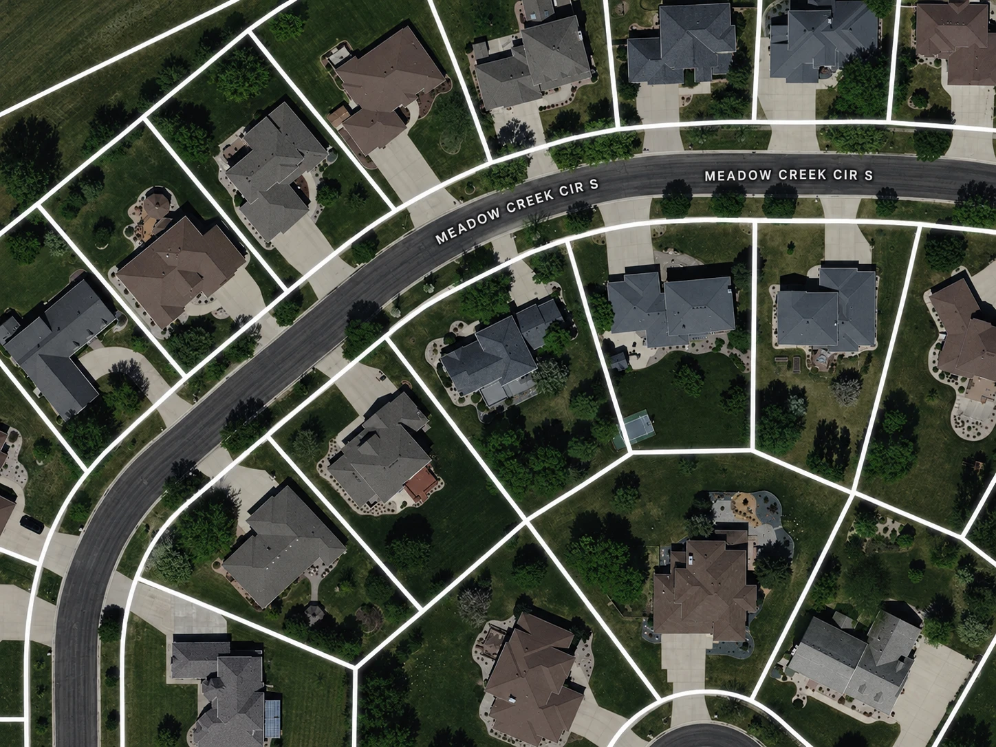 Aerial view of a neighborhood with parcel boundary lines overlaid on each property lot